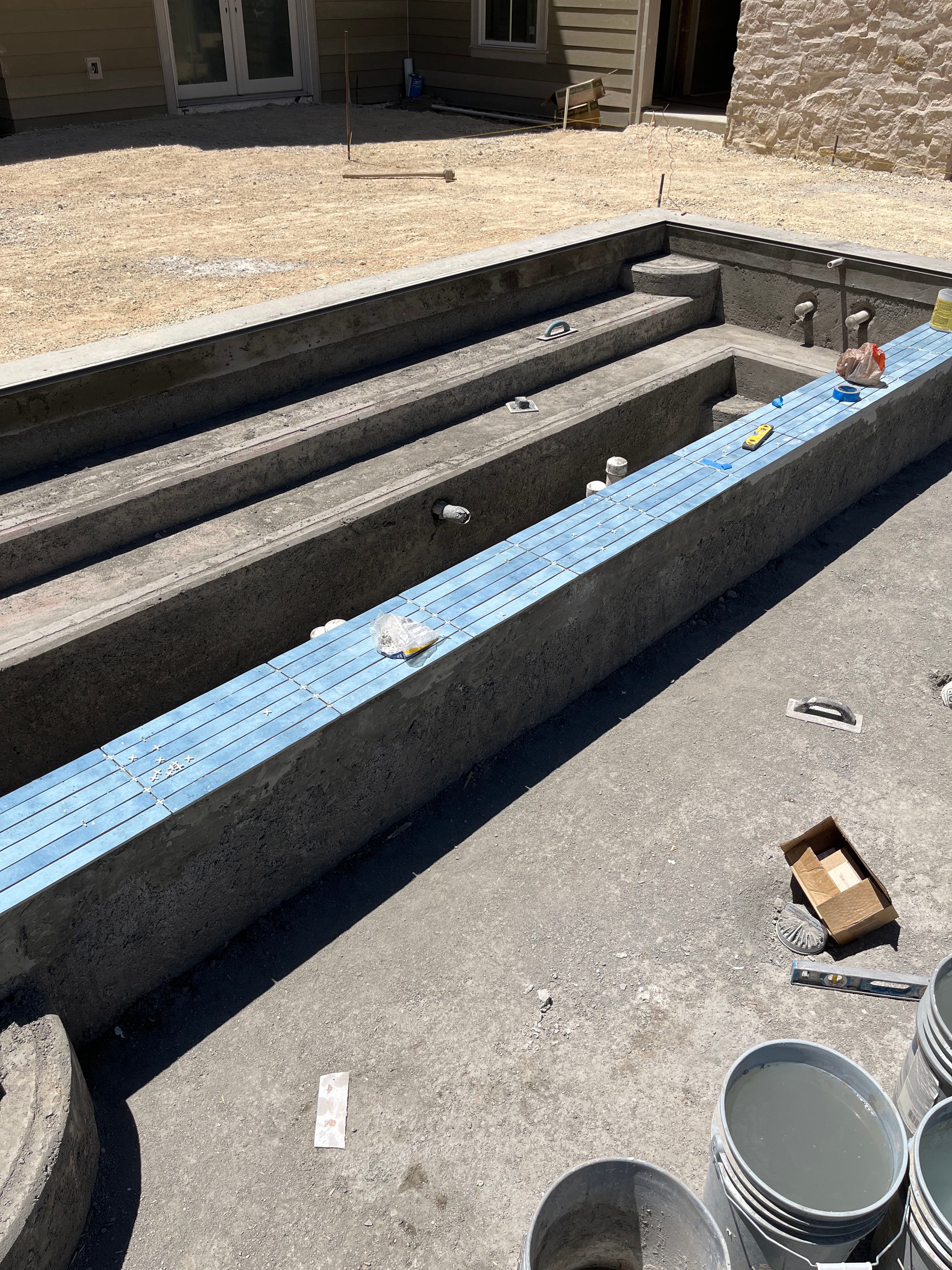 Project Setting 2x18 Tile on a 50-Foot Custom Pool Build image