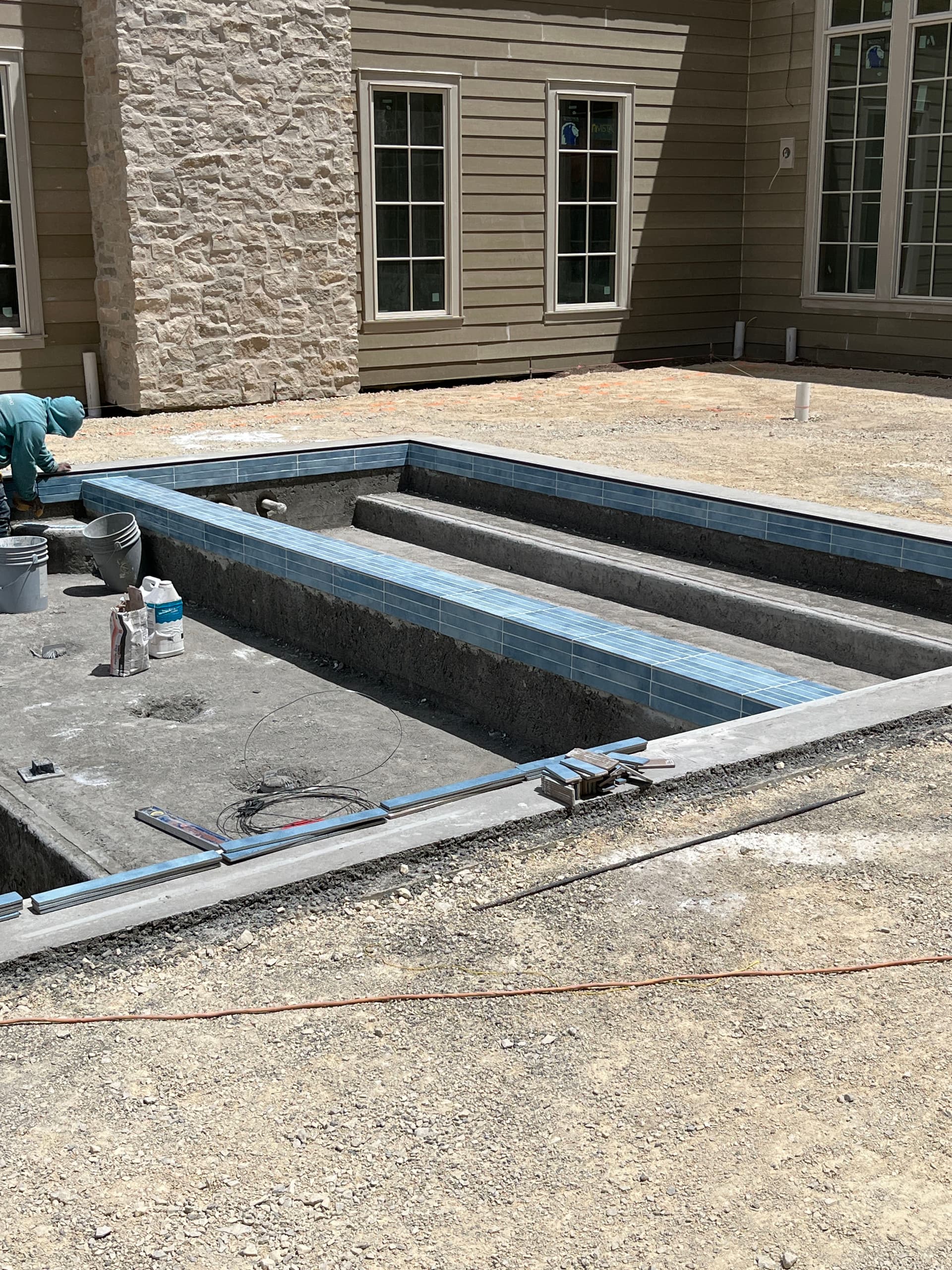 Custom Pool Tile Work Coming Together on This Build image