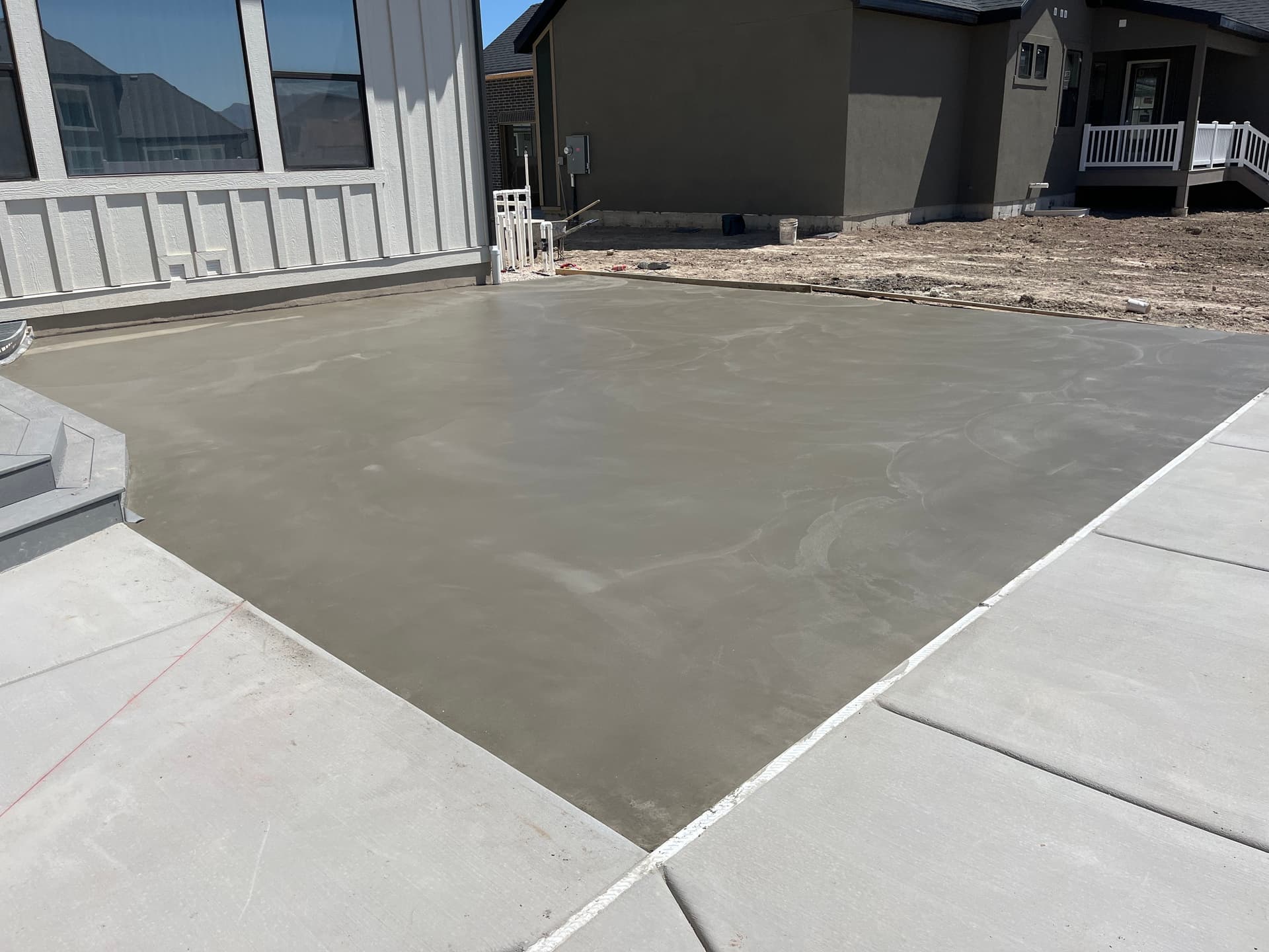 Pool Build in Progress with Concrete Deck, Coping, and Tile Work Underway image