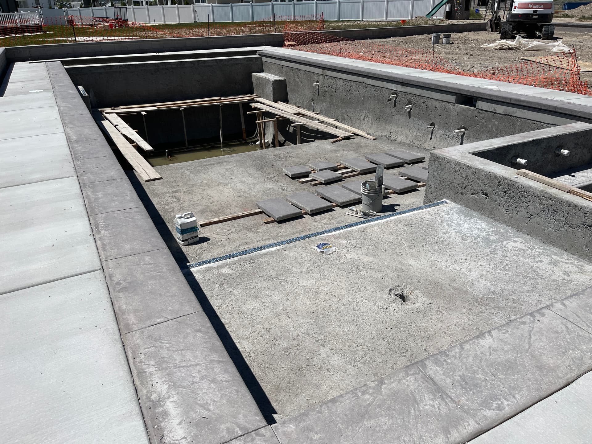 Gallery photos for Pool Build in Progress with Concrete Deck, Coping, and Tile Work Underway: Image #1